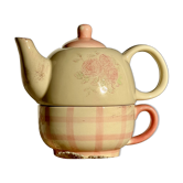 Vintage porcelain teapot and cup set with pink and beige floral and gingham pattern