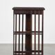 Wooden bookstand with green leather surface and on wheels in English style