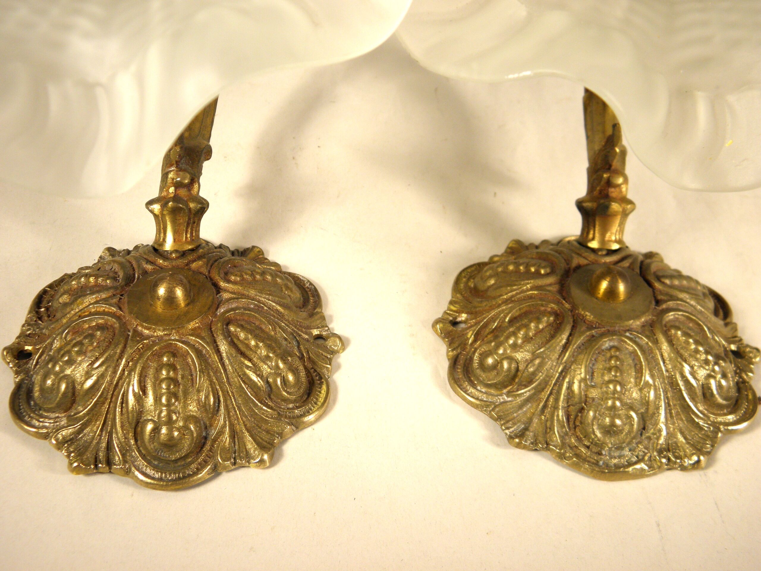 Pair of gooseneck sconces in brass and glass