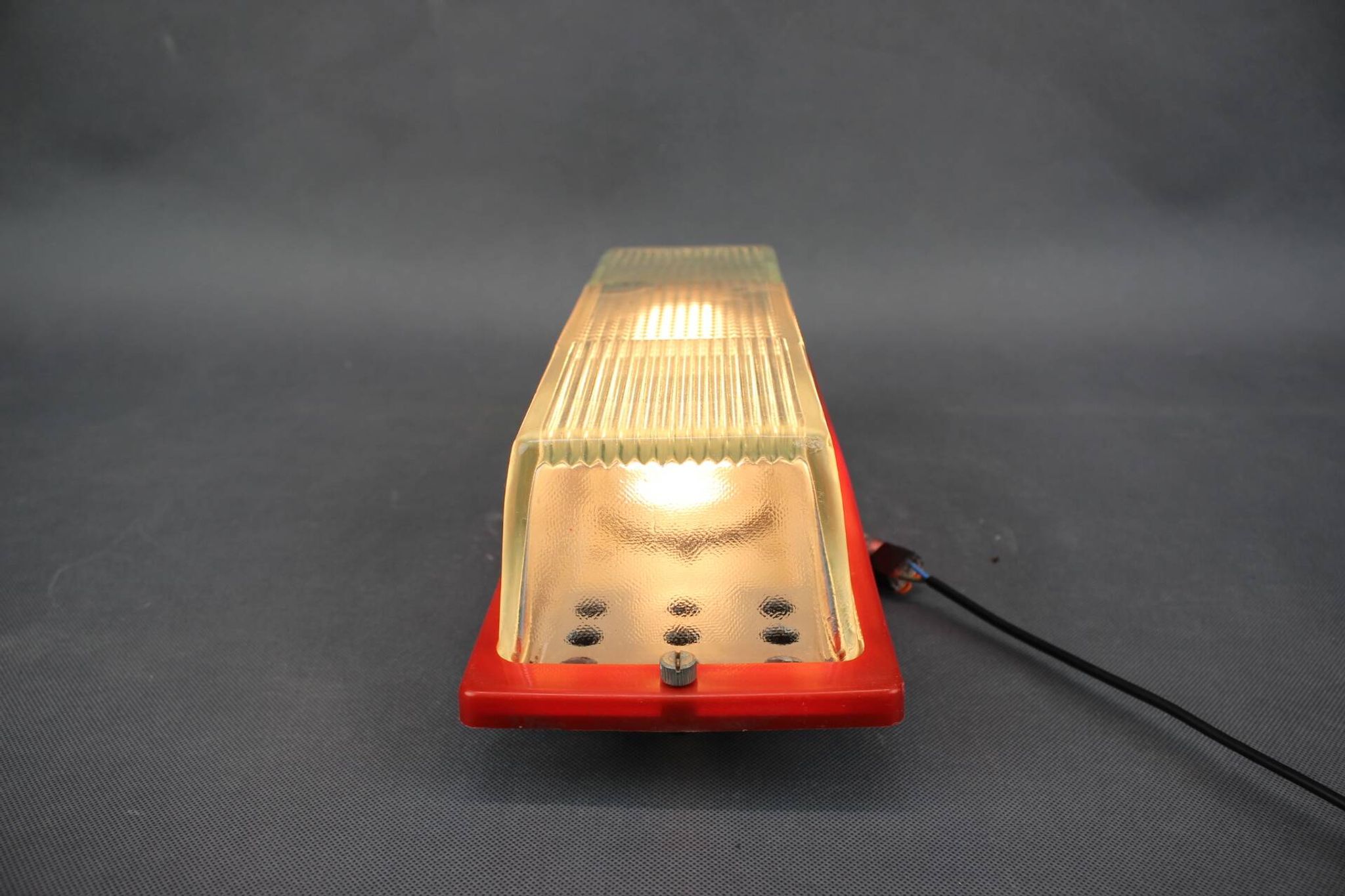 1970s Czech space age wall light with red plastic and glass.