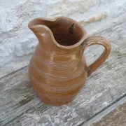 Old stoneware wine jug with patterns