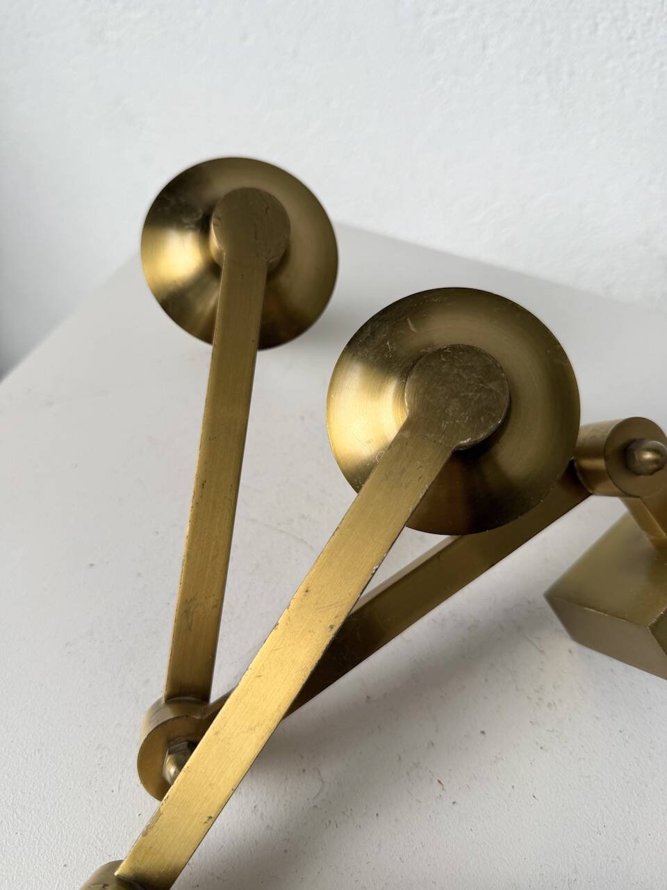 Pair of brass wall lights with articulated arms from the 70s