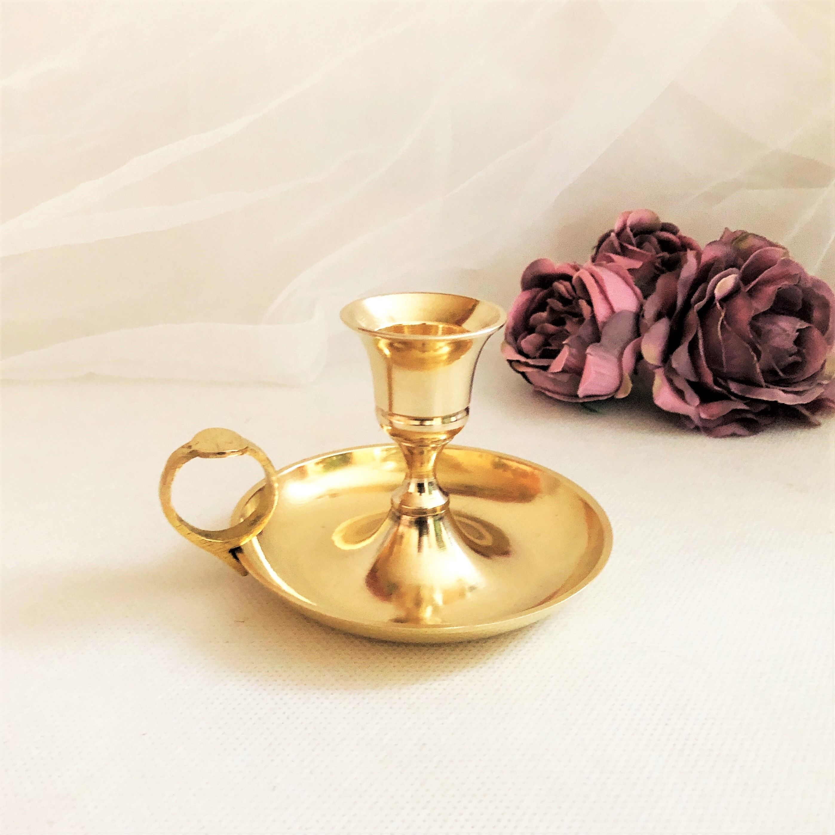 Gilded brass hand candle holder