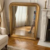 Large Louis-Philippe gilded mirror with gold leaf
