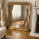Large Louis-Philippe gilded mirror with gold leaf