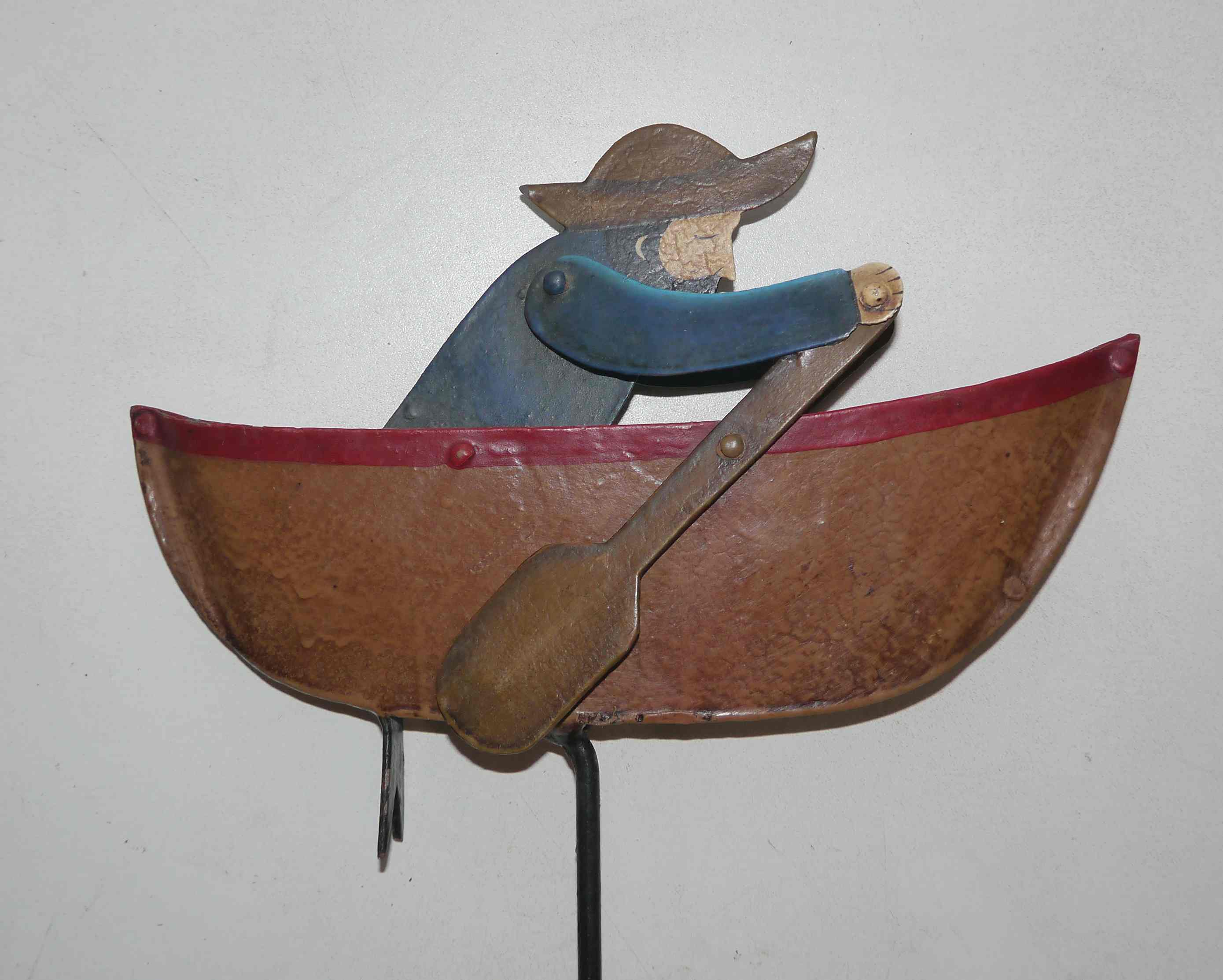 Old fishing counter balance toy in a boat