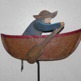 Old fishing counter balance toy in a boat