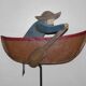 Old fishing counter balance toy in a boat