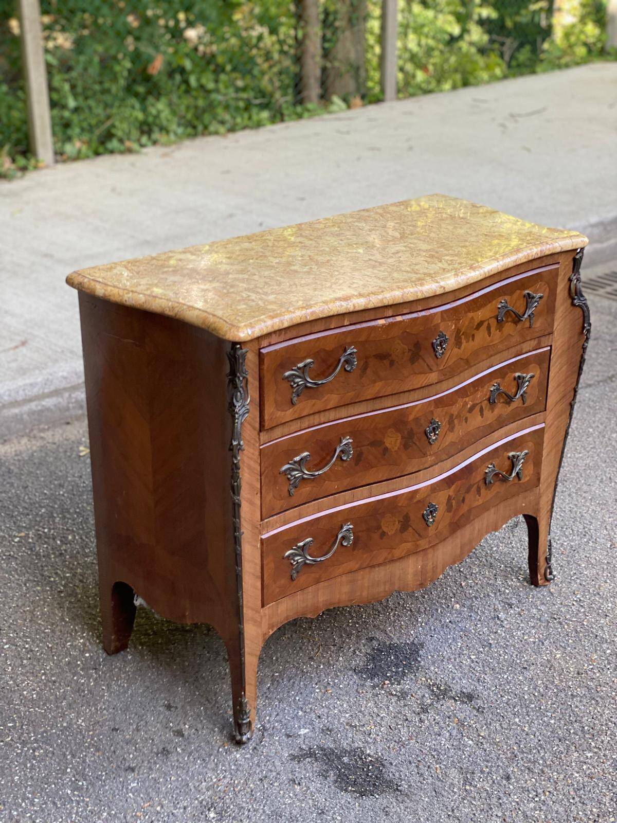Curved Louis XV chest of drawers in marquetry and beige marble