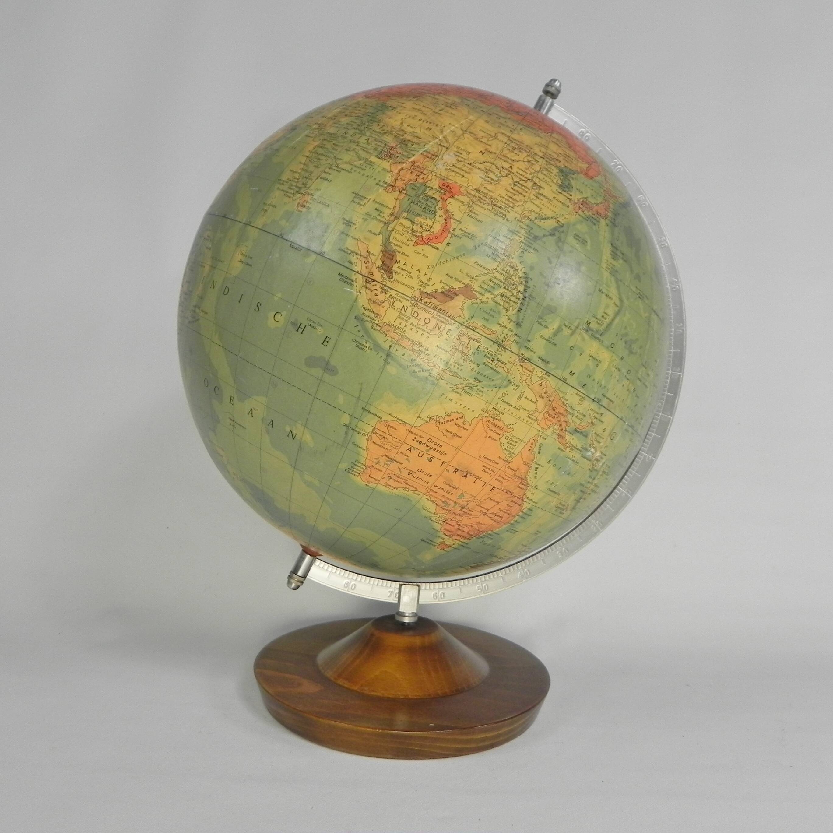 Paper mache globe on a wooden base, 1975