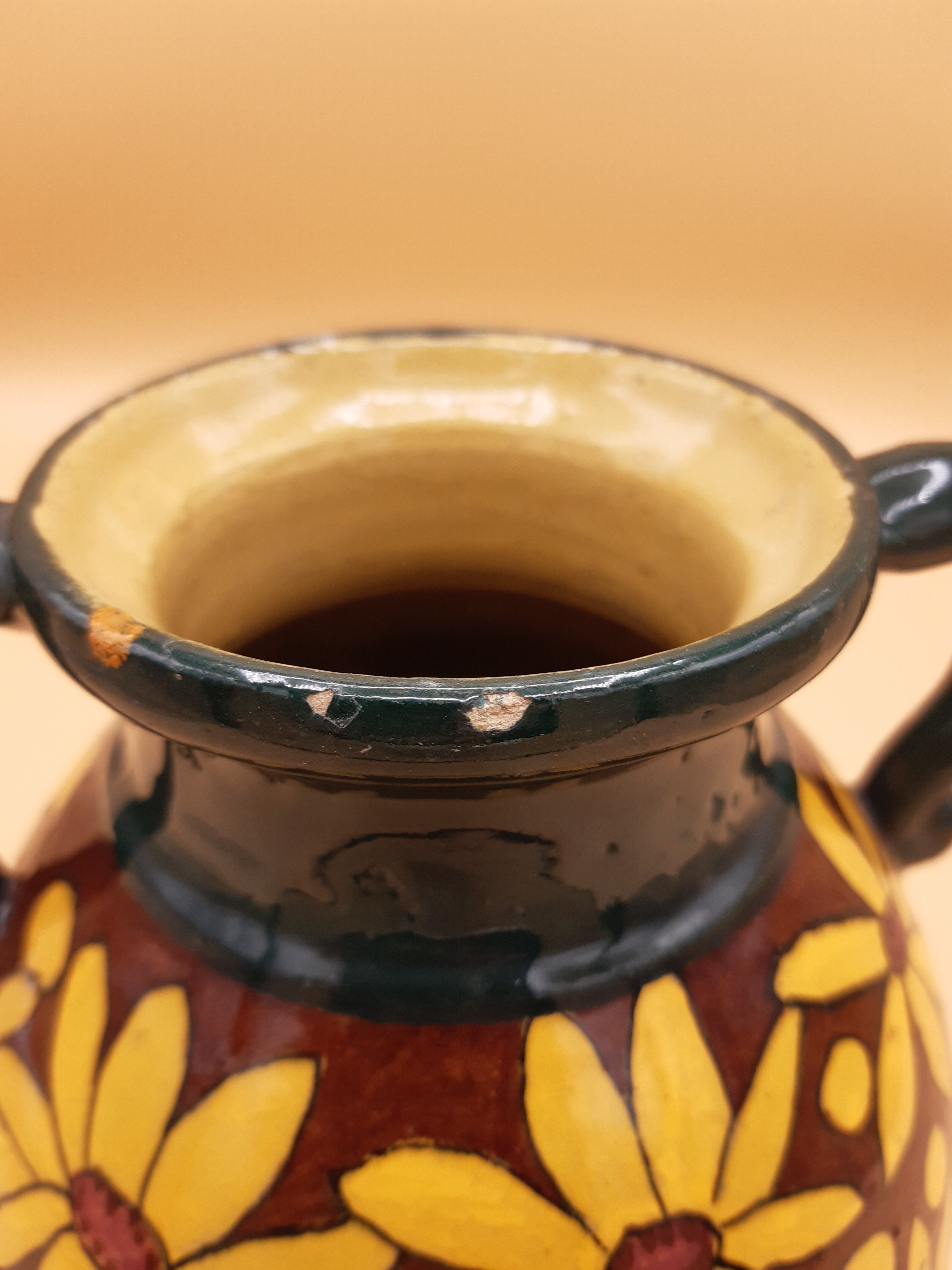 Brown and yellow daisy ceramic vase