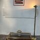 Gold metal coffee table with elm burl imitation.