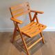 Pair of varnished wooden folding armchairs signed Clairitex.