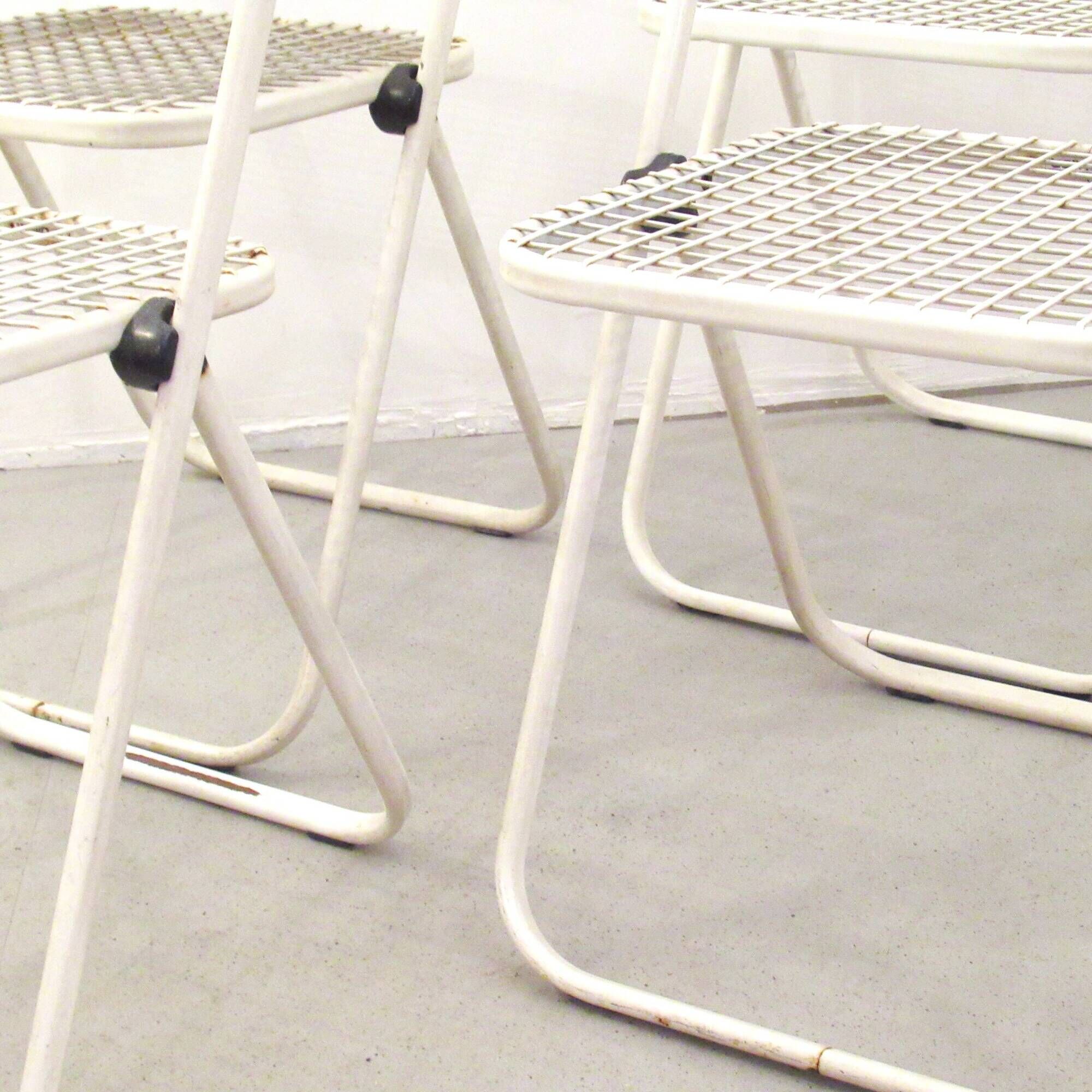 Four Talin Spa metal mesh chairs from the 1980s.