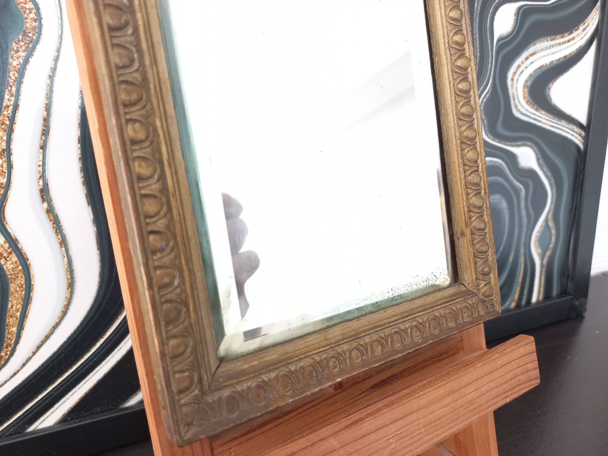 Small vintage mirror in gilded wood, bevelled glass with chain.