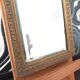 Small vintage mirror in gilded wood, bevelled glass with chain.