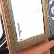 Small vintage mirror in gilded wood, bevelled glass with chain.