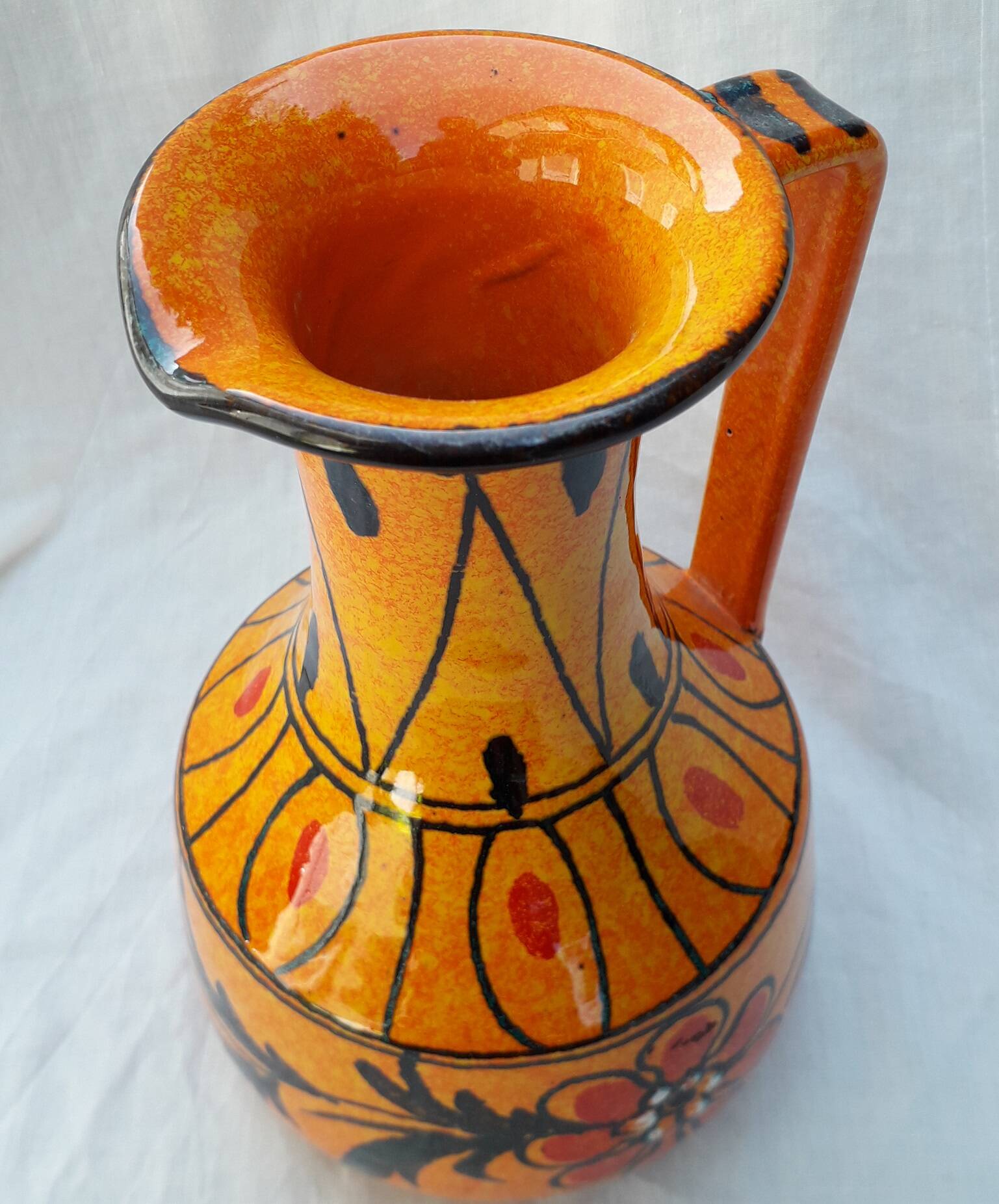 Orange ceramic pitcher from Italy