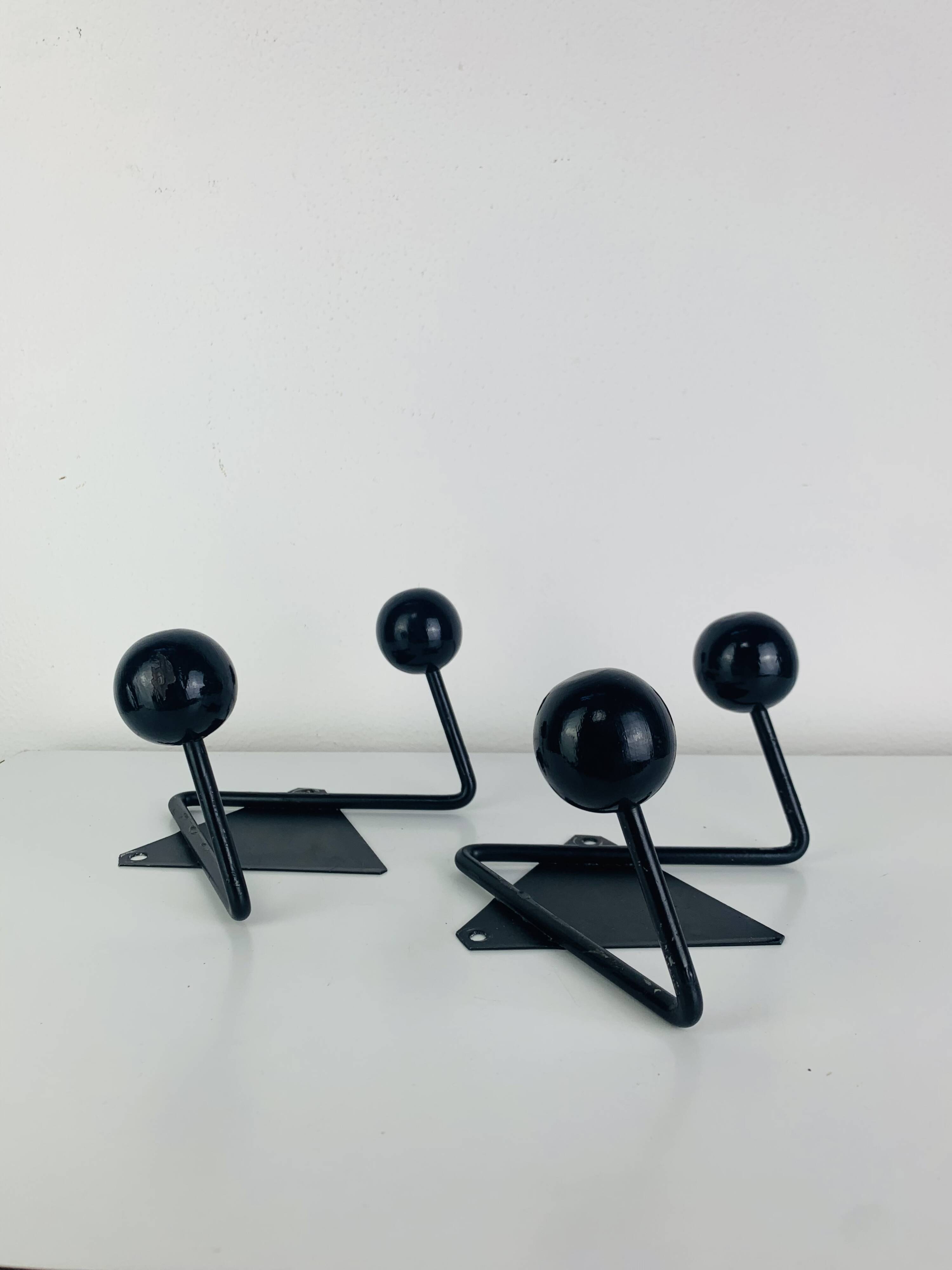 Pair of wall hooks from the 1950s, black metal