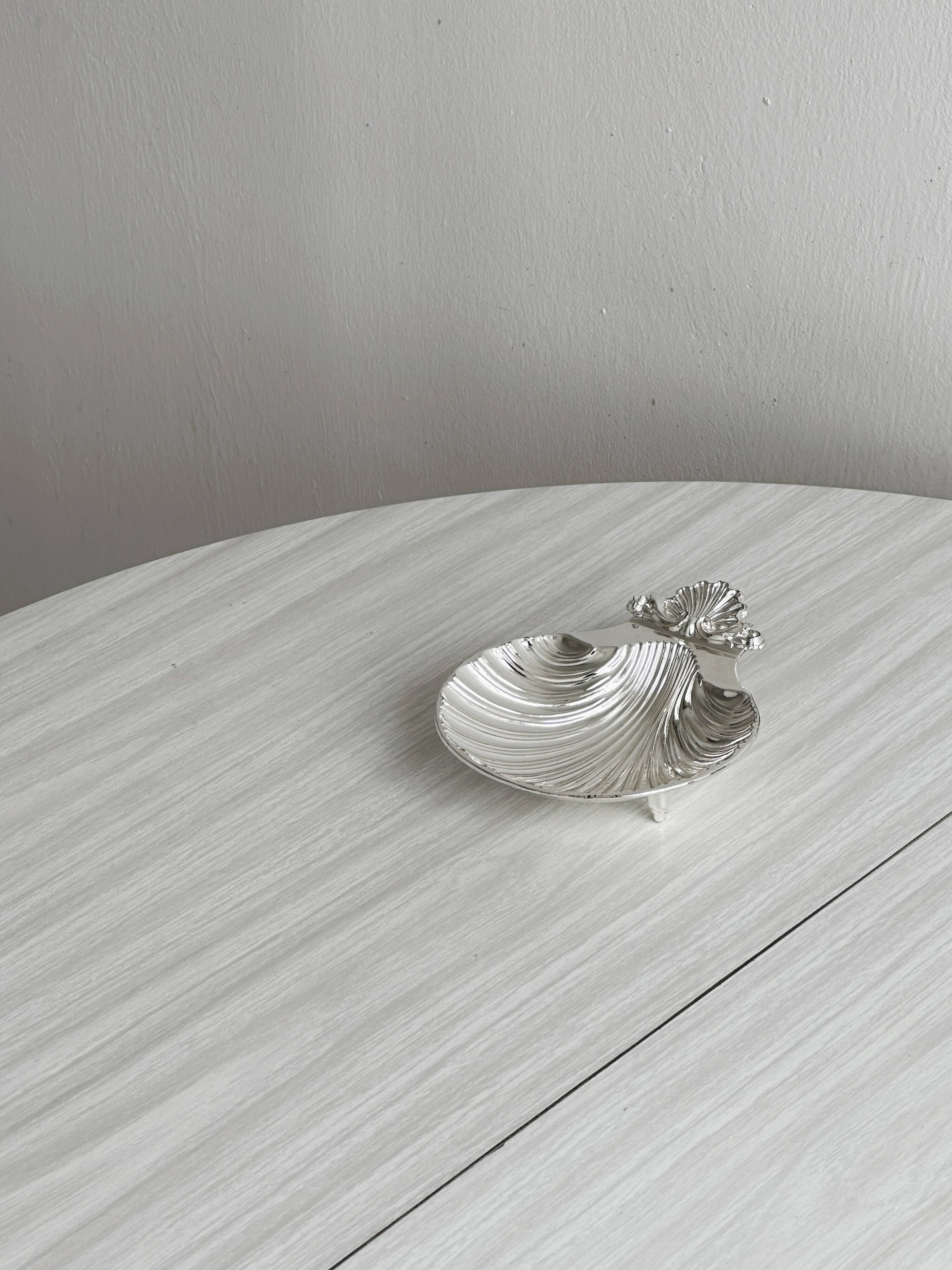 soap dish or jewelry holder in shiny metal