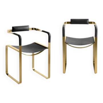 Wanderlust armchair pair in black and gold brass.