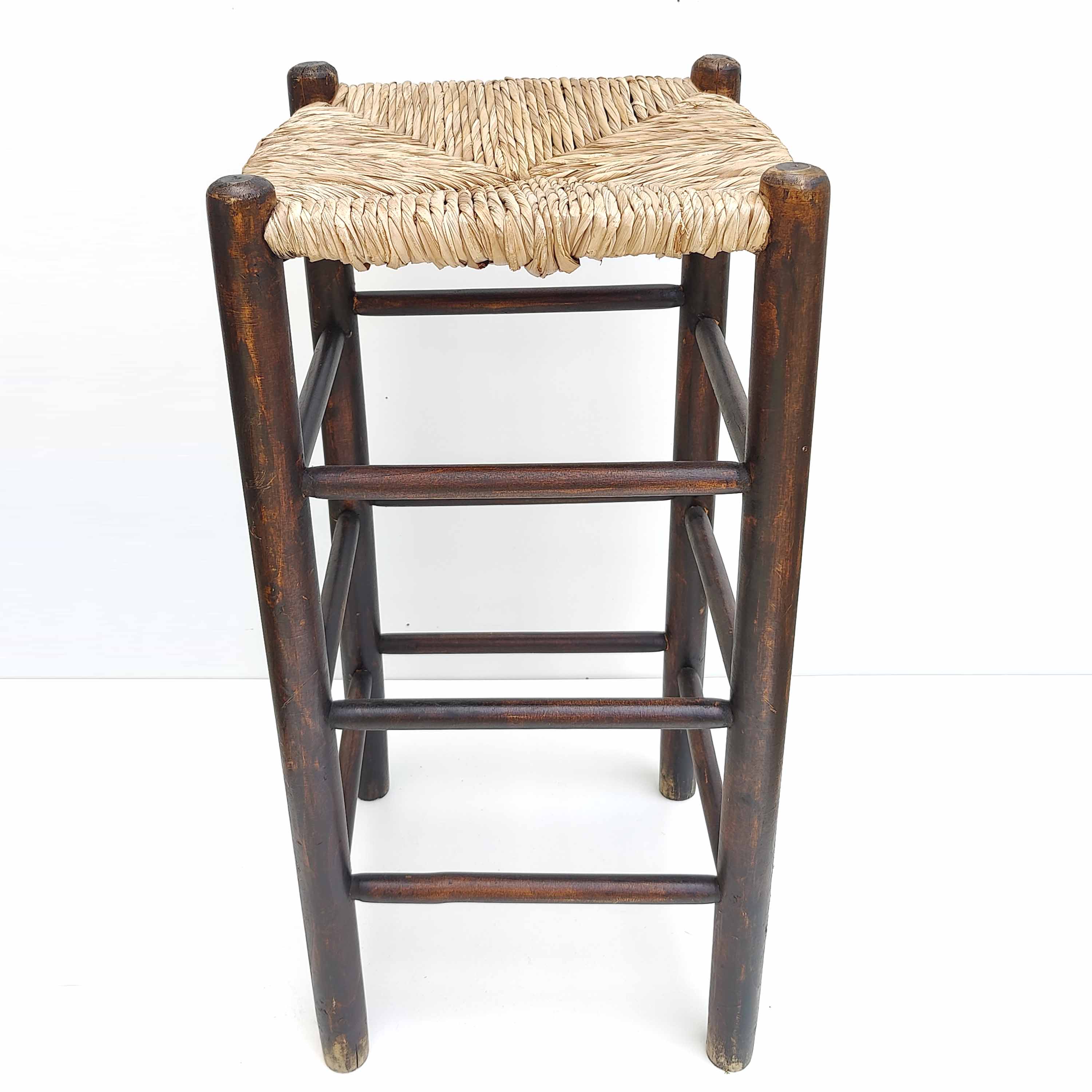 Blackened wooden bar top stool with mulched seat