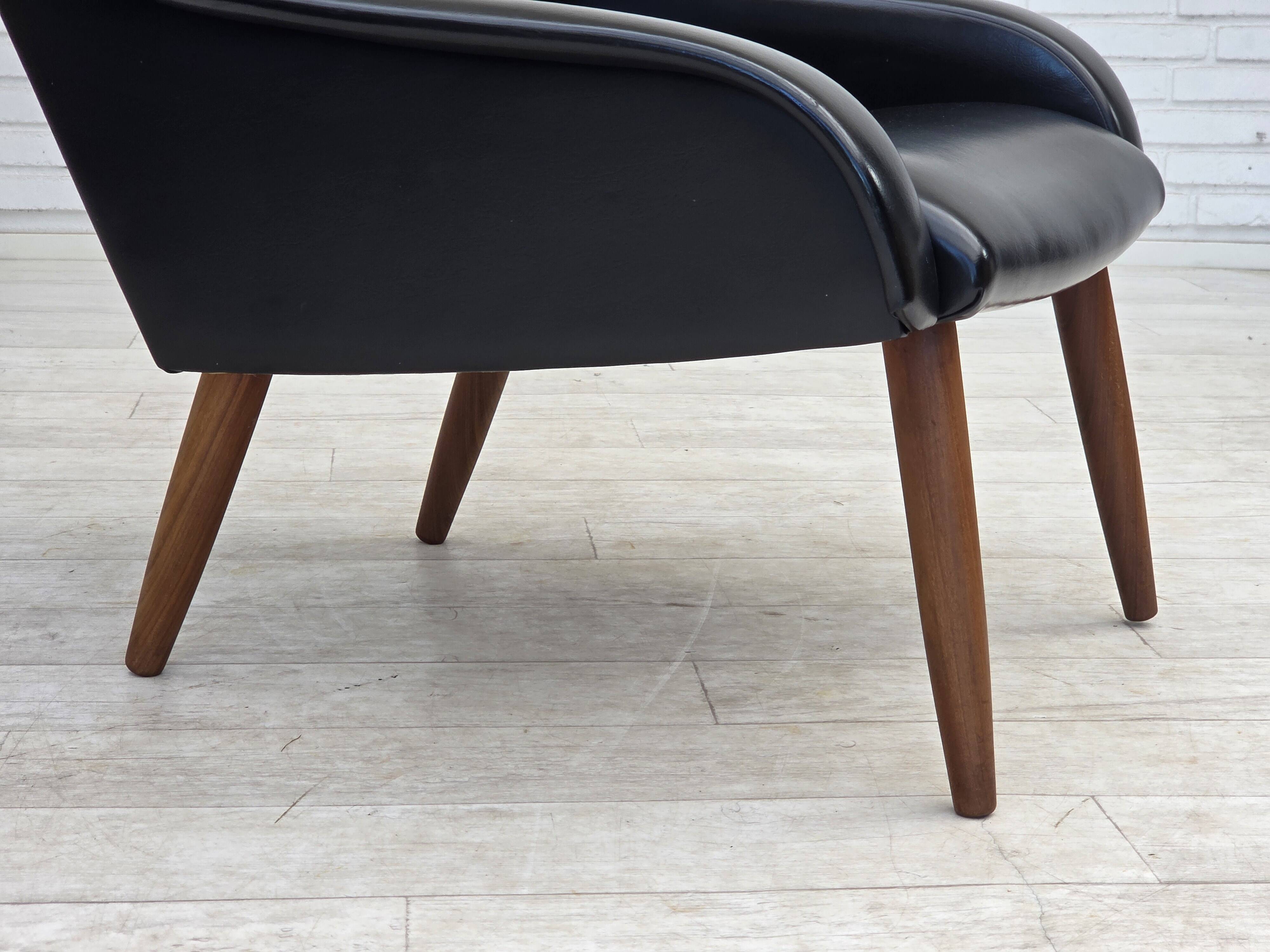 1970s, Danish armchair, black artificial leather, teak wood legs.