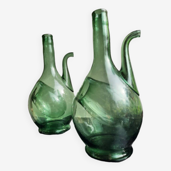 Pair of blown glass wine decanters in blue/green hues.