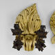 Pair of Hollywood Regency sconces in carved, painted and patinated wood, 1950s