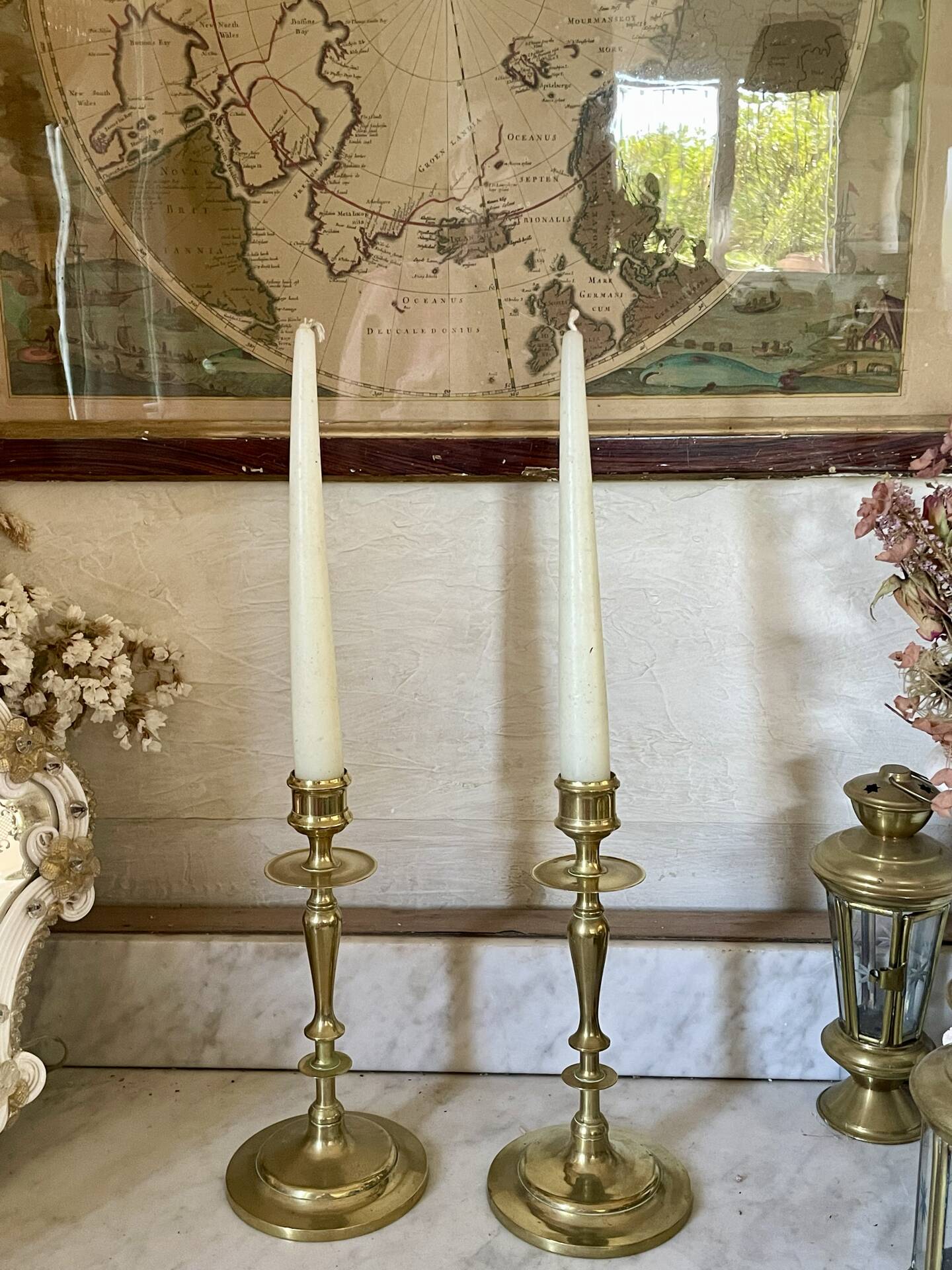 Old pair of turned brass candlesticks