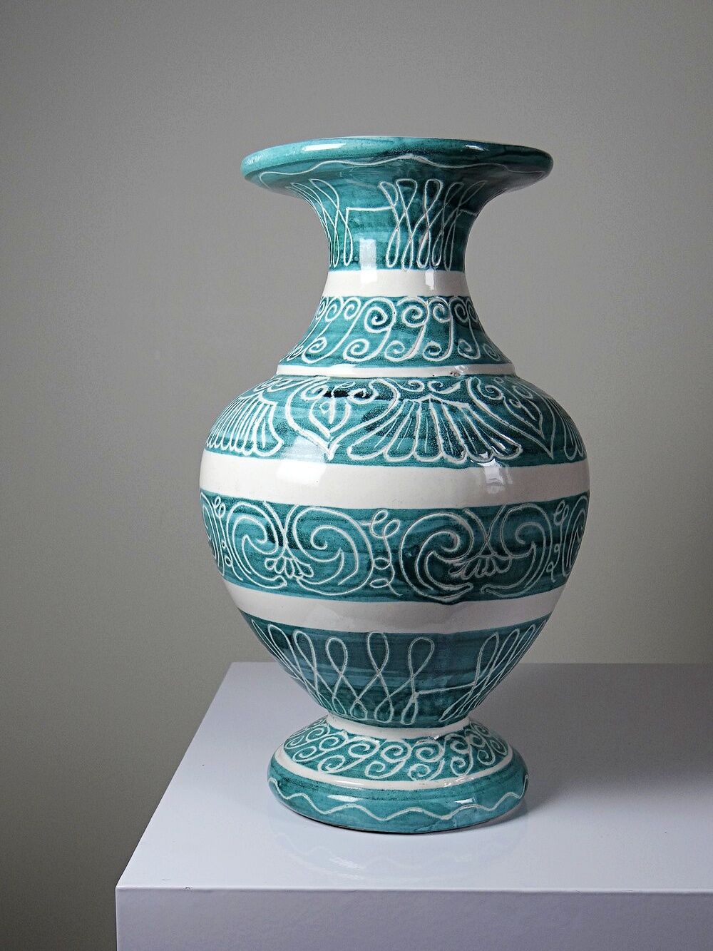 Vintage turquoise ceramic baluster vase with incised decoration.