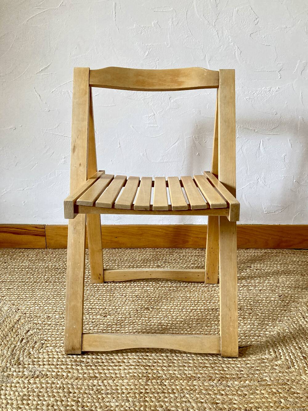 Folding chairs designed by Aldo Jacober in solid beech wood.
