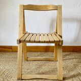 Folding chairs designed by Aldo Jacober in solid beech wood.