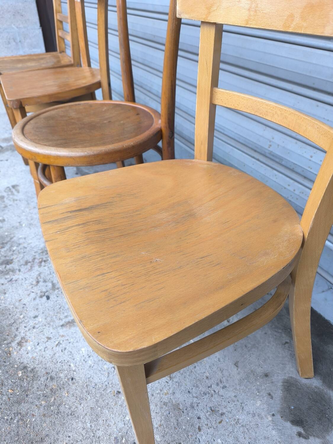 Set of four mismatched bistro chairs