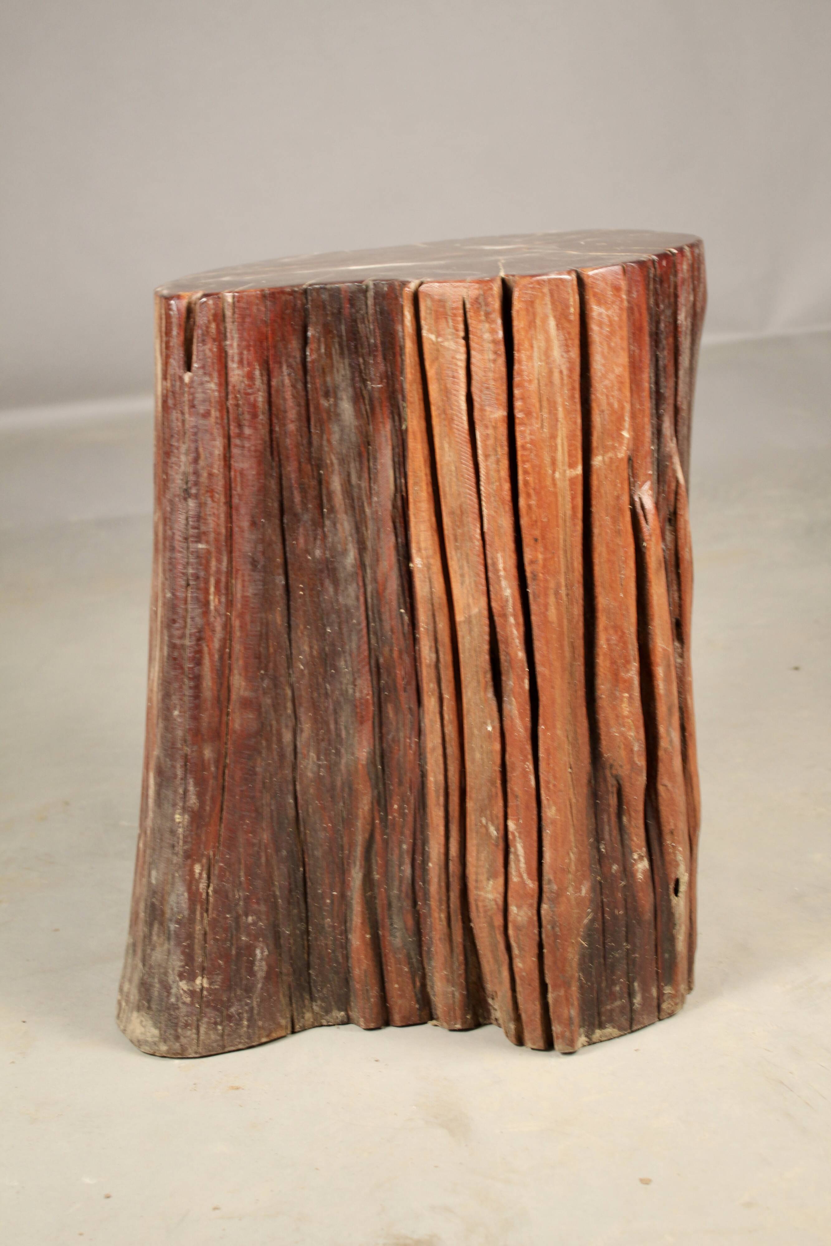 Consisting of a fossilized tree trunk seat