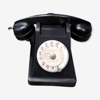 Phone has dial in bakelite