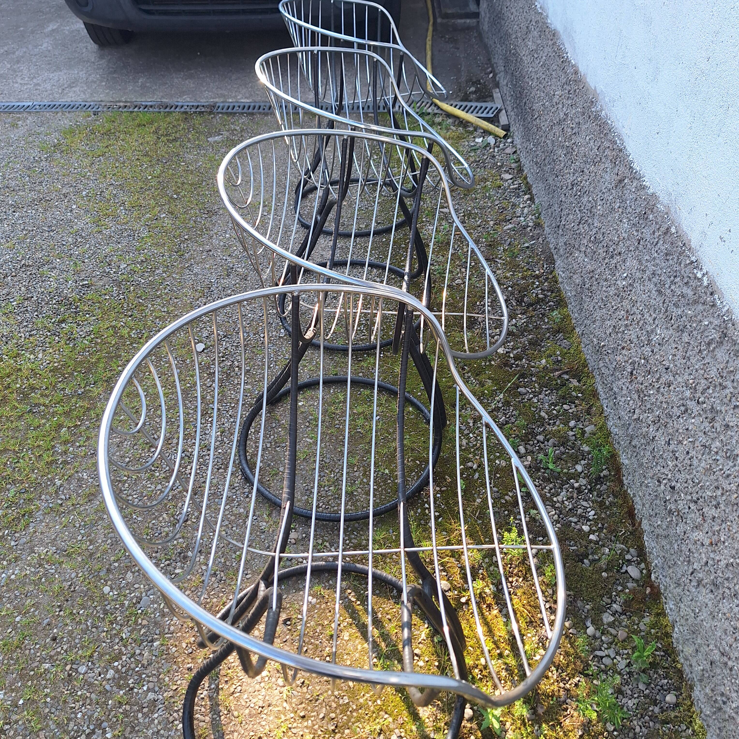 Series of 4 "Pan Am" armchairs