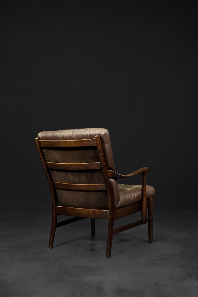 Modern vintage Danish armchair in beech and brown leather by Farstrup Møbler, 1970.