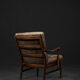 Modern vintage Danish armchair in beech and brown leather by Farstrup Møbler, 1970.