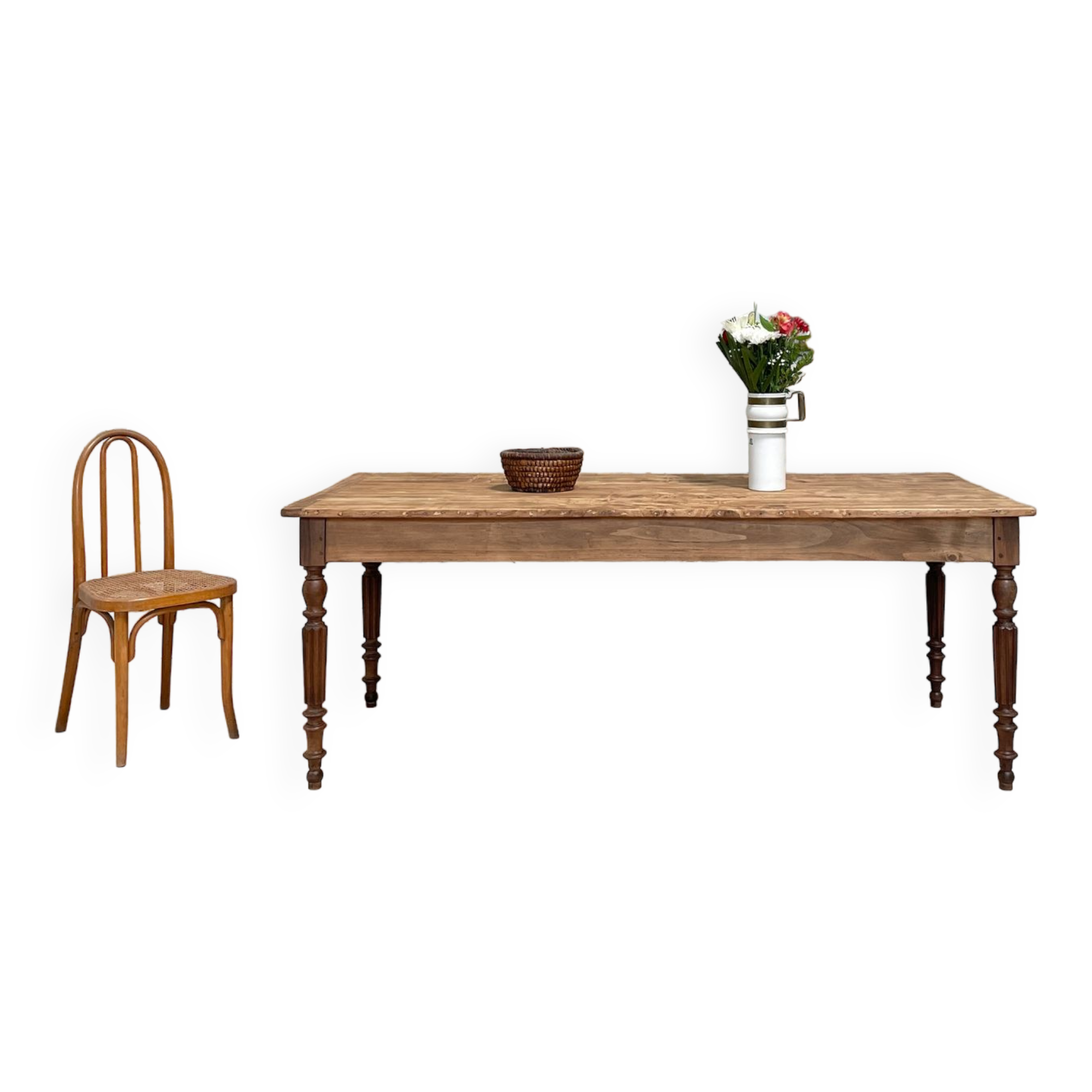 Vintage farmhouse table with turned legs.