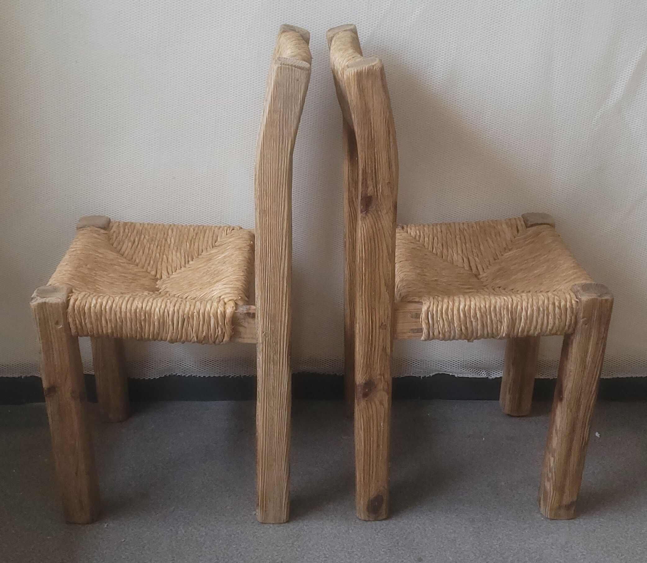Pair of brutalist chairs in wood and straw