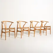 Ensemble de quatre chaises "Wishbone" CH24 de Hans J. Wegner, design de 1950.