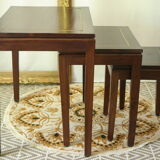 Pull-out tables in mahogany and vintage brass