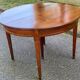 Round extendable dining table Louis XVI in cherry wood from the 1960s.