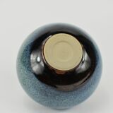 Vase with blue flowers.