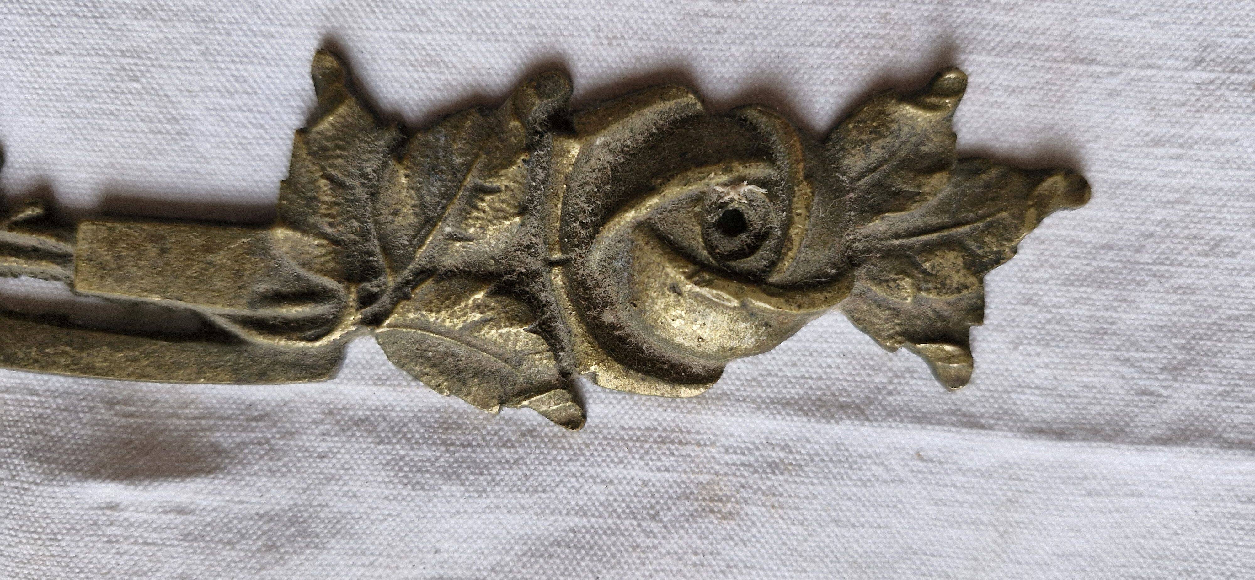 Old brass rose window, width 38cm.