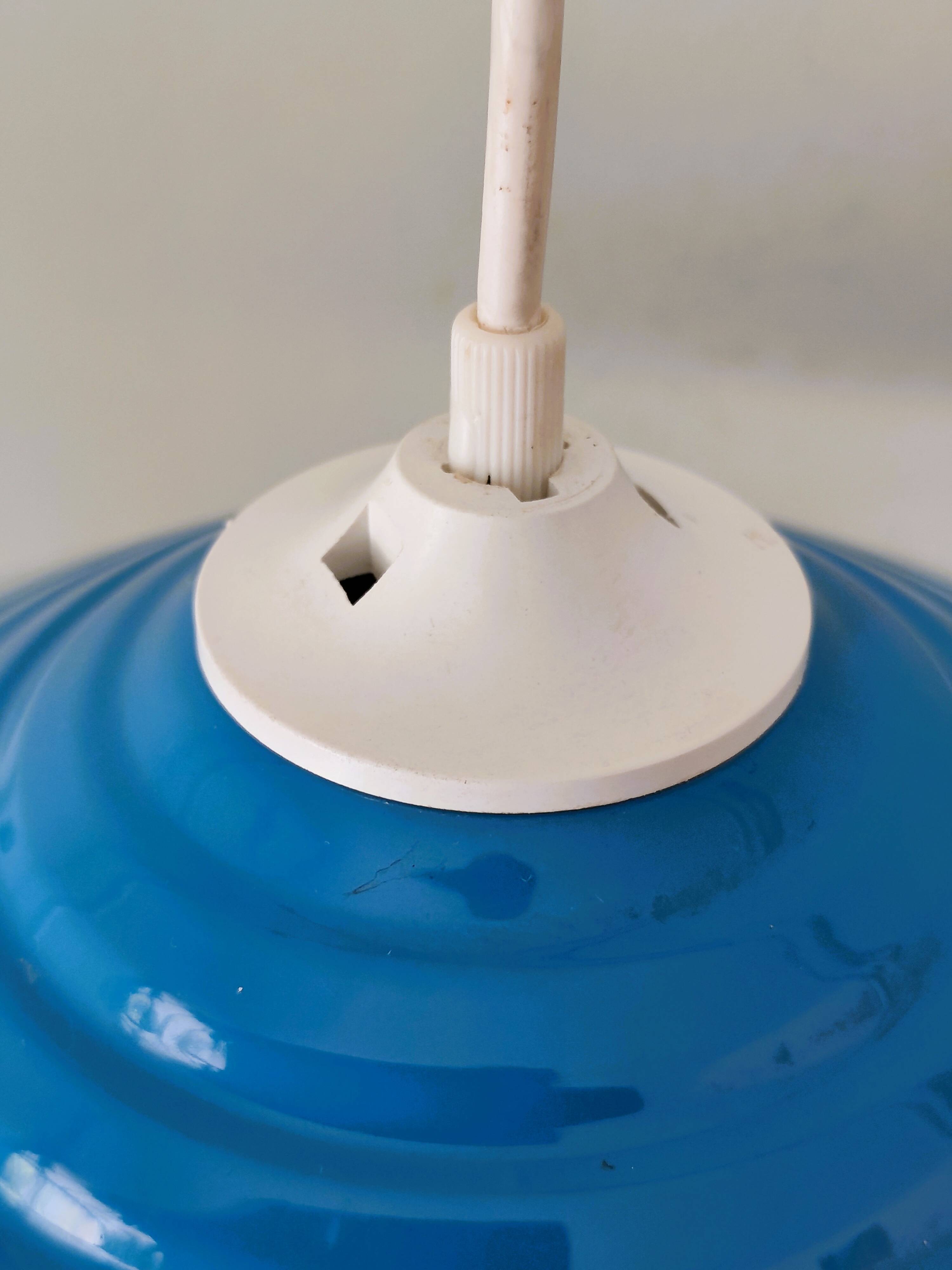 Blue lacquered metal suspension in a 70s/80s style.