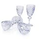 Cut crystal white wine glasses with a slender baluster-shaped stem.