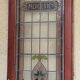 Late 19th century store doors, haberdashery front with Art Nouveau stained glass windows