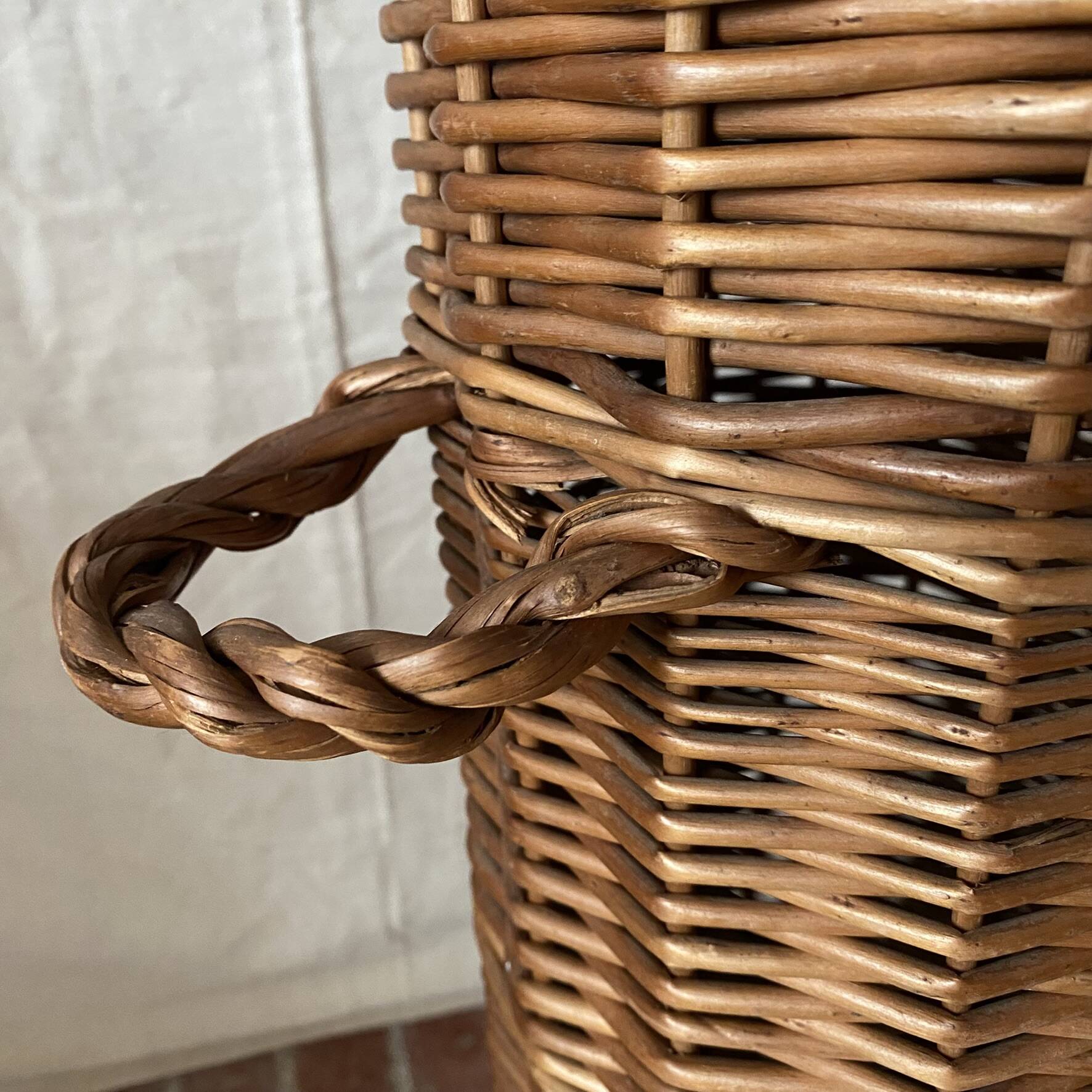 Woven wicker basket, vintage rod holder